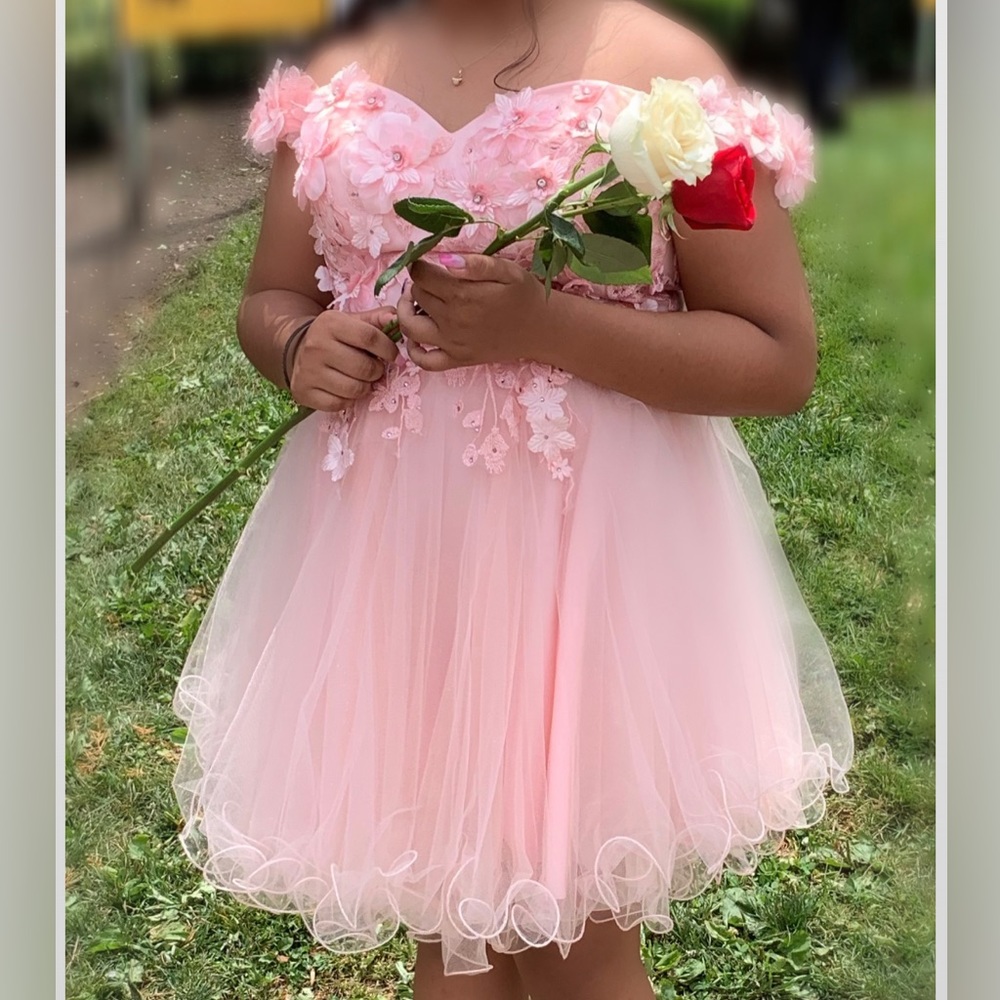 Beautiful dress wore only once. Size large adjustable back.